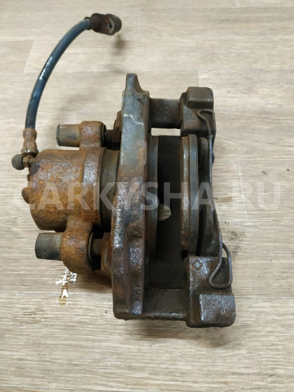 Суппорт тормозной передний правый Ford Focus оригинальный номер 1682875