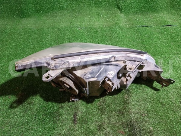 Фара левая Mitsubishi Lancer 