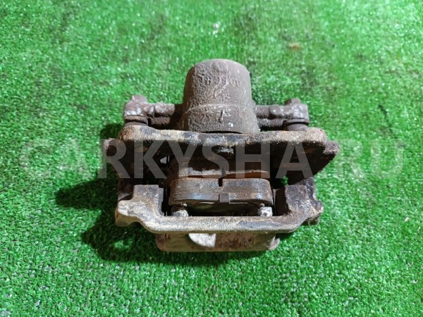 Суппорт тормозной задний левый Toyota Avensis 