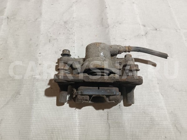 Суппорт тормозной задний левый Mitsubishi Lancer 