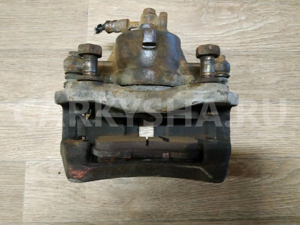 Суппорт тормозной передний левый Nissan Primera 