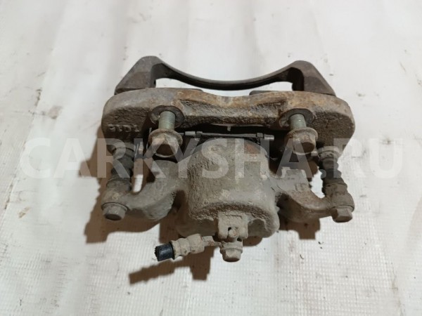 Суппорт тормозной передний правый Nissan NV200 оригинальный номер 1001JX00B