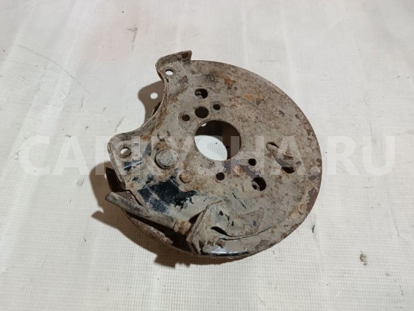 Щит опорный задний левый Mitsubishi Lancer 